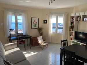 a living room with a couch and a table at Apartamento en las Rias Bajas in Ribeira