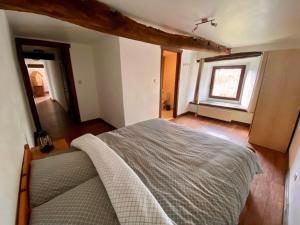 Кровать или кровати в номере Gîte Wibrin
