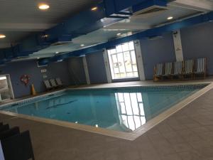 a large swimming pool in a building at H15 in Aberystwyth