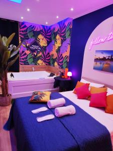 a room with two beds with pillows and a sign at Suite Maison Tropical - Luxury Apartment in Central Bari in Bari