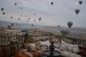 a view of a bunch of hot air balloons at Hotel Lalesaray in Uçhisar