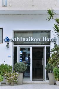 a building with a sign on the front of it at Athinaiko Hotel in Heraklio