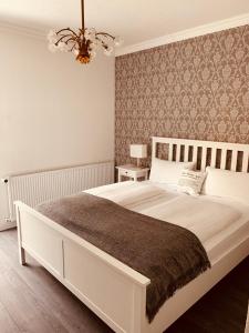 Ένα ή περισσότερα κρεβάτια σε δωμάτιο στο Villa am Südpark