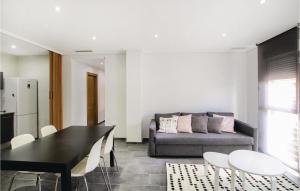 a living room with a table and a couch at Lovely Apartment In Dolores With Wifi in Dolores