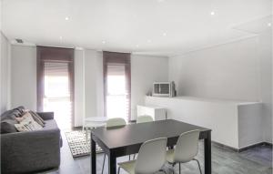 a living room with a black table and chairs at Lovely Apartment In Dolores With Wifi in Dolores