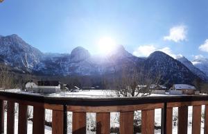 a view of a mountain range with snow on the ground at Dachstein Adventure in Obertraun