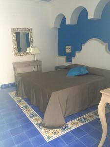 Postel nebo postele na pokoji v ubytování La Pineta Hotel Beach & Spa