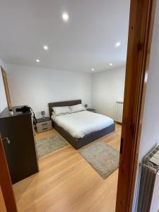 A bed or beds in a room at Appartamento Ca' Baci'