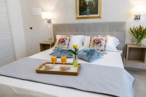 Postel nebo postele na pokoji v ubytování Alloggio Turistico Port Inn