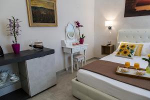 Postel nebo postele na pokoji v ubytování Alloggio Turistico Port Inn