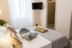 TV a/nebo společenská místnost v ubytování Alloggio Turistico Port Inn
