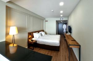 Voodi või voodid majutusasutuse Monte Hotel toas