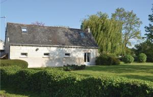 an old stone house in the middle of a yard at Lovely Home In Saumur With Wifi in Saumur