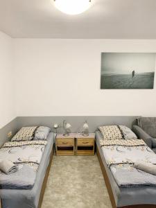 Ένα ή περισσότερα κρεβάτια σε δωμάτιο στο Penzion Ivana