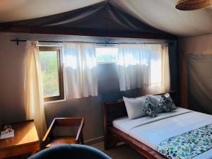 Cama o camas de una habitación en Oldonyo Orok Lodge