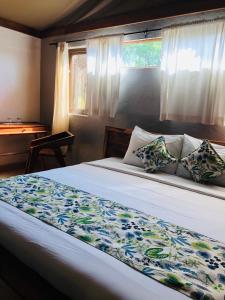 Cama o camas de una habitación en Oldonyo Orok Lodge