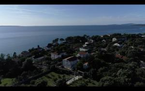 an aerial view of a small village on a hill by the water at Silba Belvedere (2) 45m from the beach in Silba