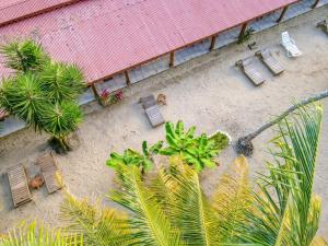 an overhead view of a patio with chairs and trees at Yucca Beachfront Hotel in Puerto Viejo