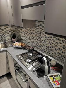 A kitchen or kitchenette at AGAS Exclusive Apartment