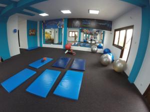 a room with blue mats and balls on the floor at Apartmani ,,Vasa ,, 3 in Soko Banja +6 photos