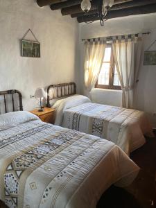 Postel nebo postele na pokoji v ubytování Cortijo La Miel