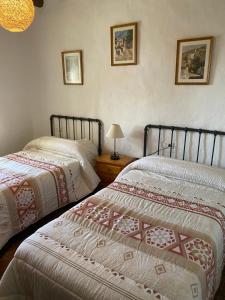 Postel nebo postele na pokoji v ubytování Cortijo La Miel