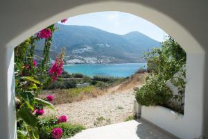 an archway with a view of a body of water at Amorgi Studios in Aegiali