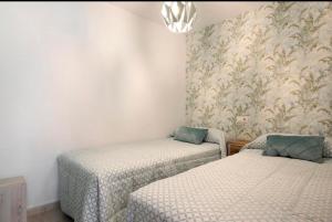 Posteľ alebo postele v izbe v ubytovaní Duplex One