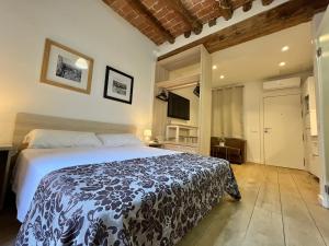 מיטה או מיטות בחדר ב-Estudio Port Serrallo