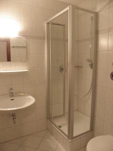 a bathroom with a shower and a sink at Dependance am Blumenbrunnen in Baden-Baden