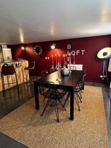 a dining room with a table with candles on it at BLB Loft Luxury House in Villenave-dʼOrnon