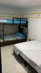 Voodi või voodid majutusasutuse Palomino Hostel toas
