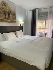 Postel nebo postele na pokoji v ubytování Hotel Carlos III