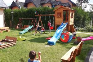 a group of children playing on a playground at Holiday homes, Niechorze in Niechorze