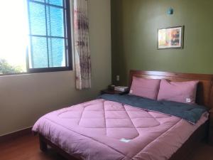Postel nebo postele na pokoji v ubytování Anh Duong Hotel