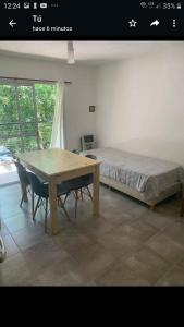 Ένα ή περισσότερα κρεβάτια σε δωμάτιο στο Departamentos Talamuchita