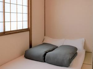 Postel nebo postele na pokoji v ubytování Guesthouse Hakuka