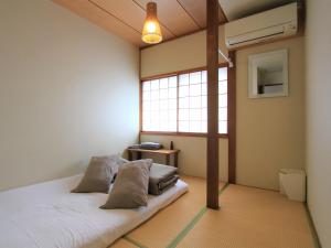 Postel nebo postele na pokoji v ubytování Guesthouse Hakuka