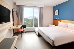 Voodi või voodid majutusasutuse ibis Styles Bogor Pajajaran toas