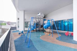 a playground in a building with a slide at iCity 1Bedroom Apt Near Mall FREE PARKING & WIFI in Shah Alam