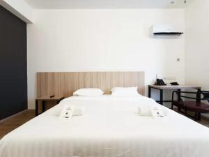 Postel nebo postele na pokoji v ubytování Starlink Hotel