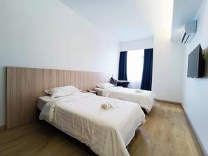 Postel nebo postele na pokoji v ubytování Starlink Hotel