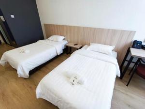 Postel nebo postele na pokoji v ubytování Starlink Hotel