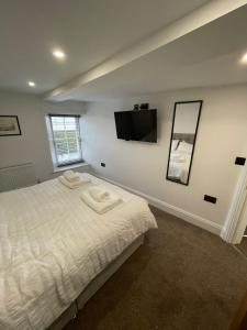 Ένα ή περισσότερα κρεβάτια σε δωμάτιο στο Grade II Listed House in the Lake District - Perfect deployment location for Coast to Coast cyclists & hikers