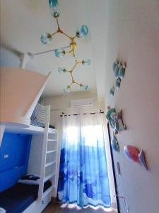a bedroom with a bunk bed with a chandelier at 墾丁藍洞青旅 Blue Hole Backpacker Inn in Hengchun