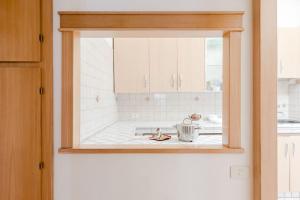 A kitchen or kitchenette at Elegant Apartment Via Veneto by Varental