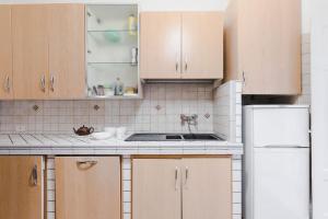 A kitchen or kitchenette at Elegant Apartment Via Veneto by Varental
