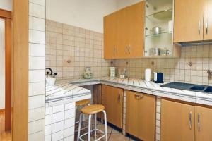 A kitchen or kitchenette at Elegant Apartment Via Veneto by Varental