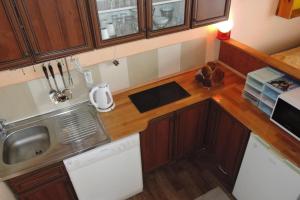 an overhead view of a kitchen with wooden cabinets at Semi-detached house, Wiselka in Wisełka