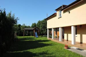 a yard next to a house with a yard at holiday home, Miedzyzdroje in Międzyzdroje